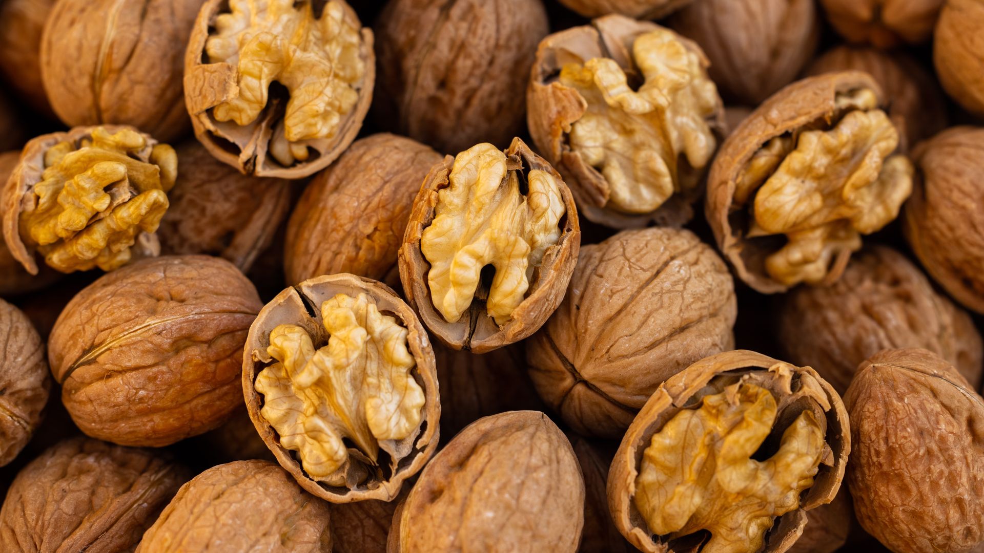 Cracked walnuts showing light kernels